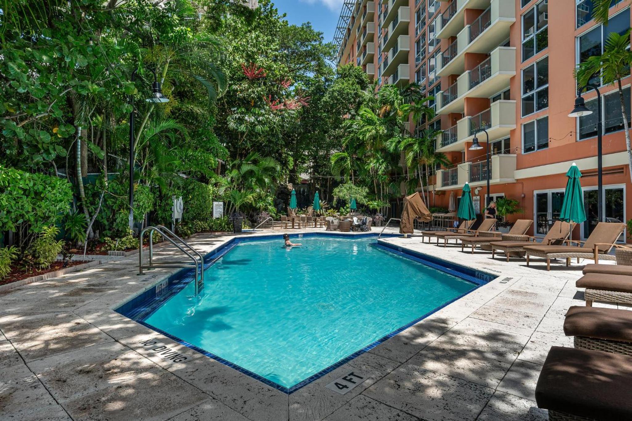 The Palms Coconut Grove 1 bedroom condo includes parking