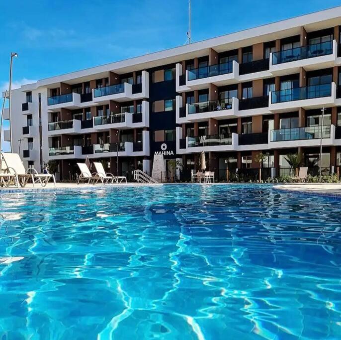 Flat em Muro Alto Porto de Galinhas com Piscina, Ar-condicionado e Cozinha Equipada