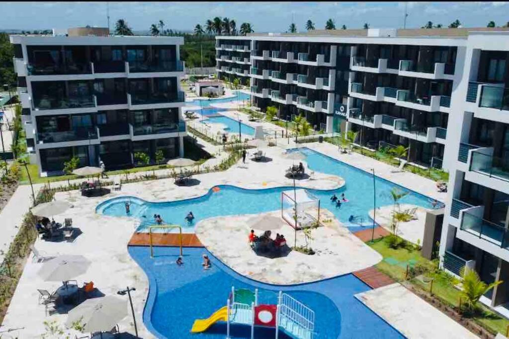 Flat em Muro Alto Porto de Galinhas com Piscina, Ar-condicionado e Cozinha Equipada