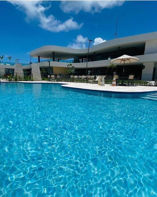 Flat em Muro Alto Porto de Galinhas com Piscina, Ar-condicionado e Cozinha Equipada