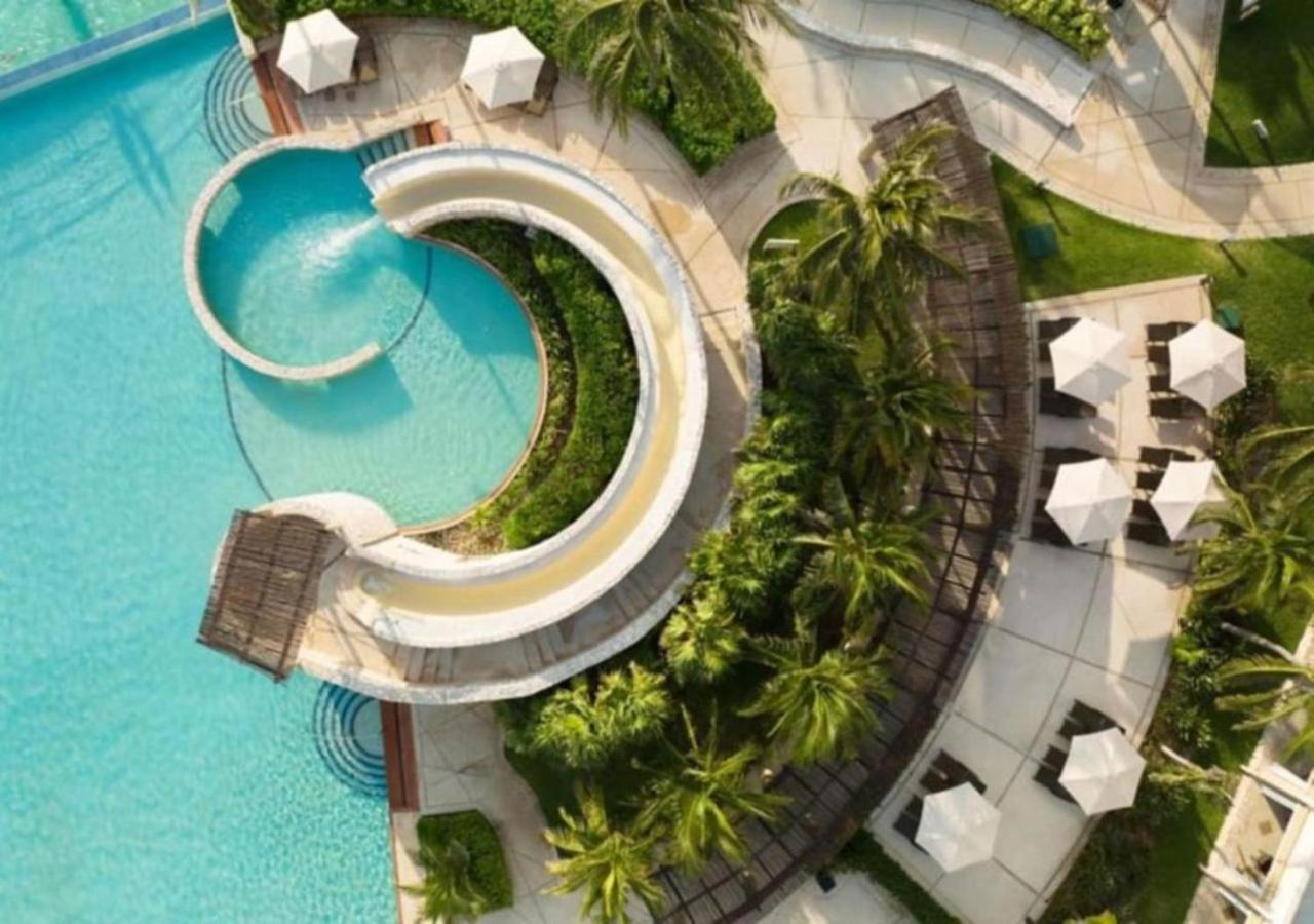 Enjoy the white sand resort beach in a 1BD vacation condo onsite infinity pool, spa, and mini golf