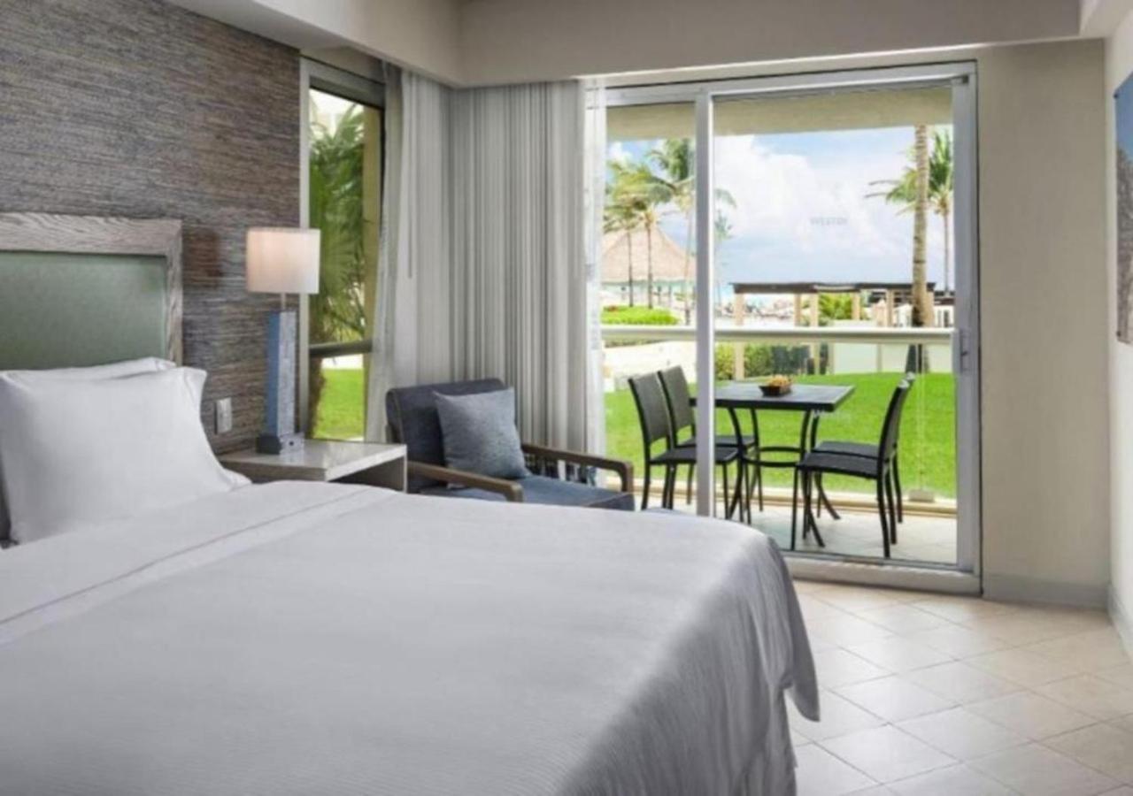 Enjoy the white sand resort beach in a 1BD vacation condo onsite infinity pool, spa, and mini golf