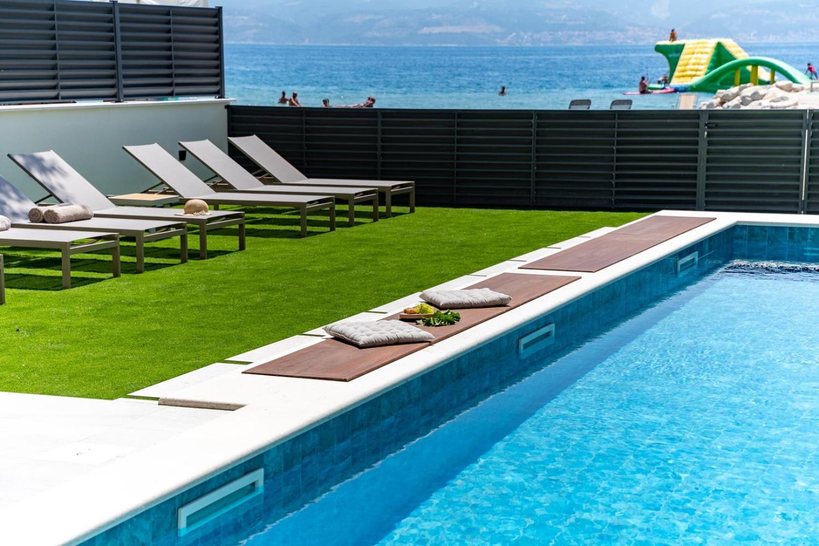 Beachfront Villa Erce with private 40sqm heated pool, a Gym, 7 en-suite bedrooms, a rooftop terrace, 2 living areas view 3