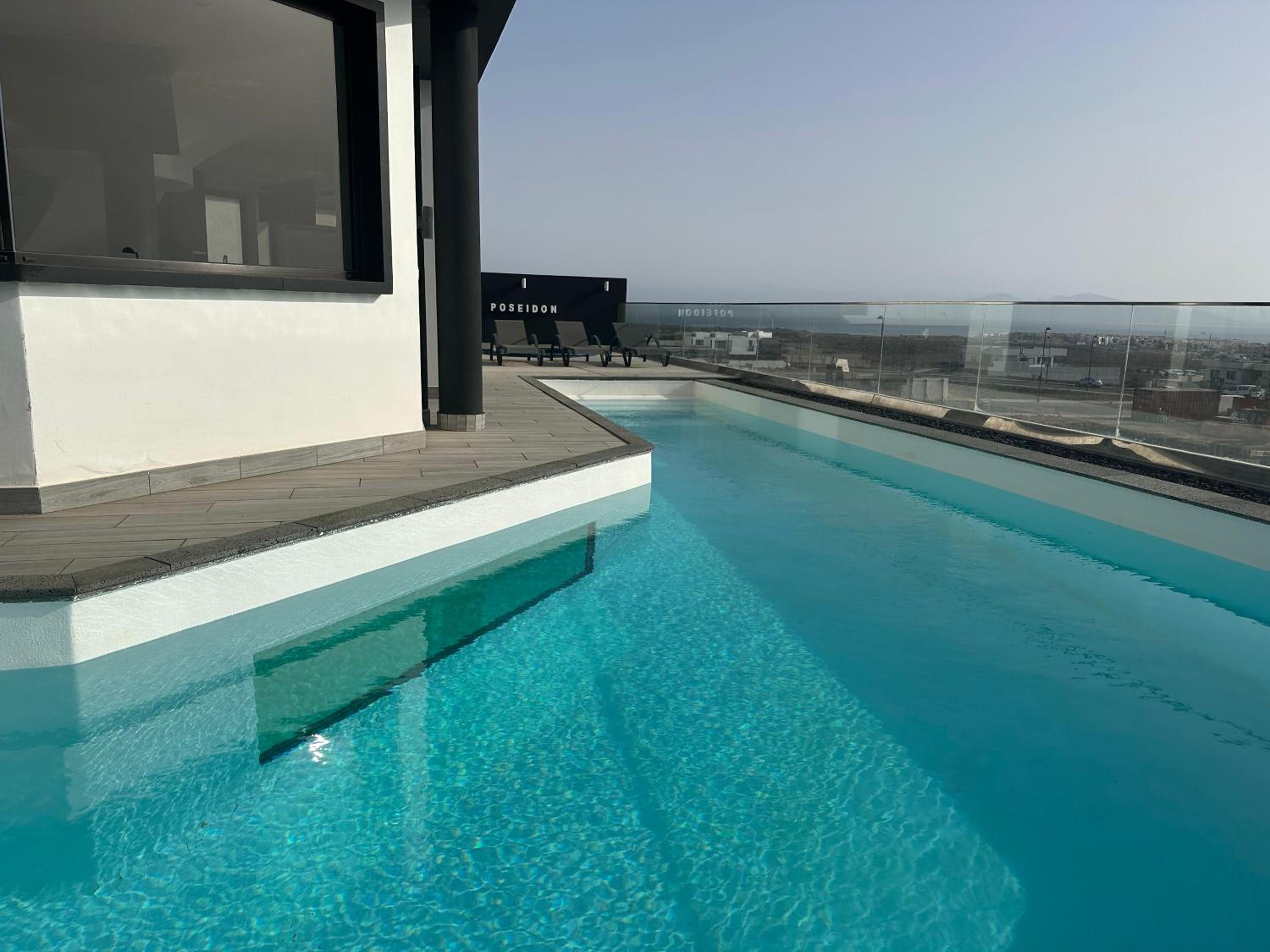 Hotel Villa Poseidon Corralejo with Private Heated Pool, Jacuzzi, Sauna and Stunning Volcano Views by Amazzzing Travel - Image 1