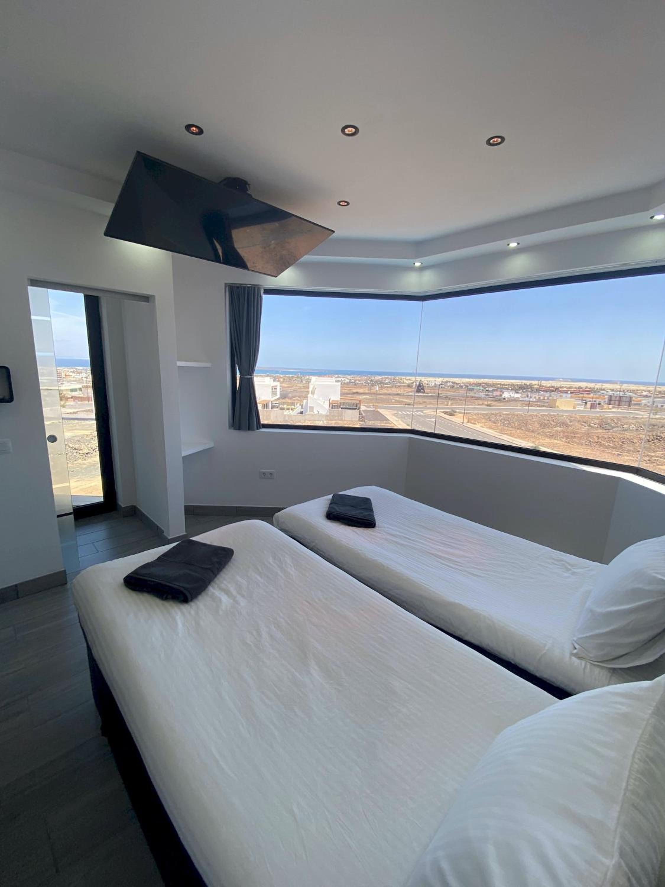 Villa Poseidon Corralejo with Private Heated Pool, Jacuzzi, Sauna and Stunning Volcano Views by Amazzzing Travel
