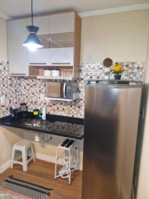 Flat Reformado à 350m da praia, com piscina