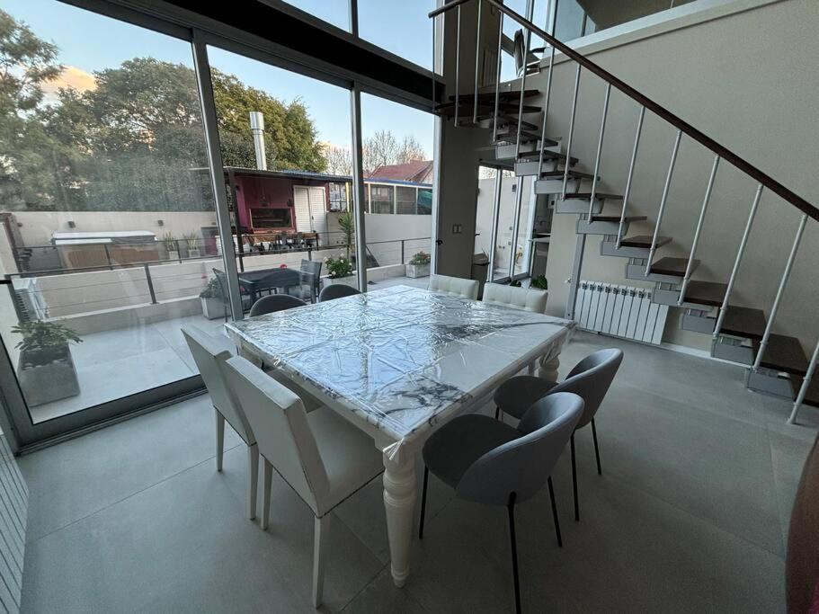 Modern Two-story House with Terrace in Nuñez River