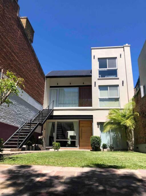 Modern Two-story House with Terrace in Nuñez River