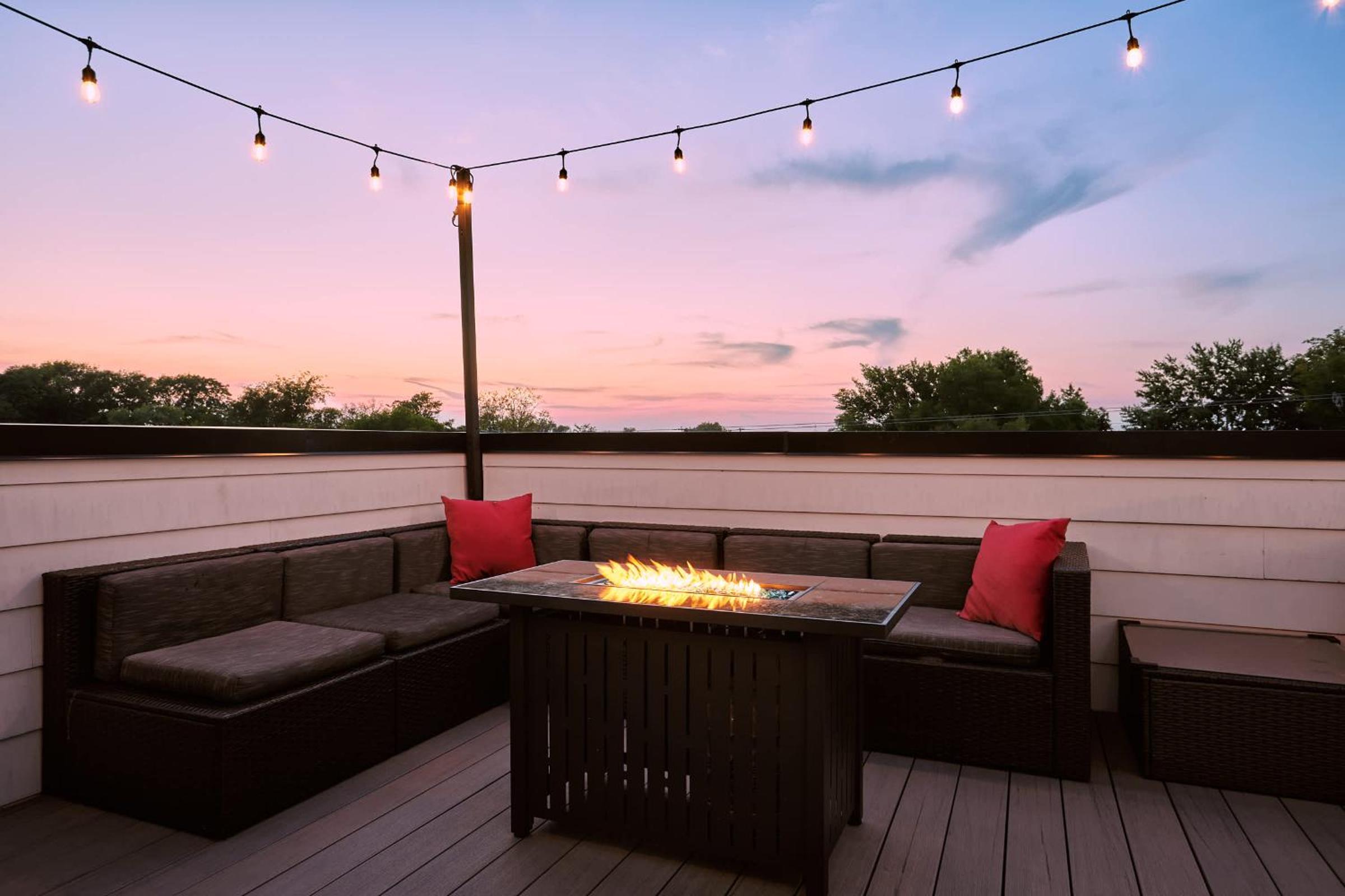 Photograph supplied for Stylish 3 Bed Retreat, Rooftop, Parking, Sleeps 10, Ensuite Baths, Bunk Room, Gourmet Kitchen, Cozy Living Space, Rooftop Views & Fire Table, Near Downtown
