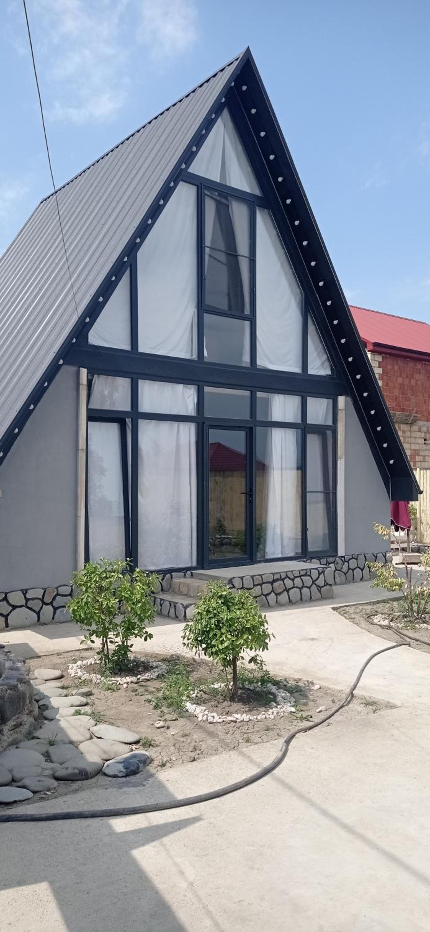 Guba A-frame near forest & lake