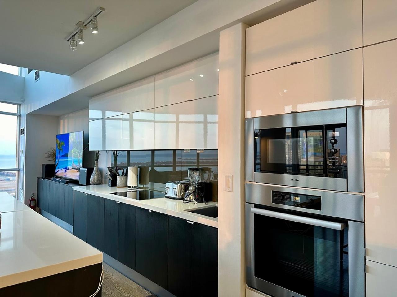 City/Lake view 2-storey condo w/parking