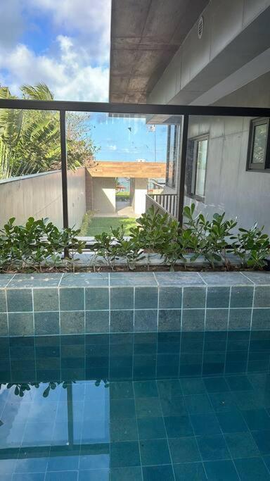 Apartamento térreo com piscina beira mar de Porto de Galinhas