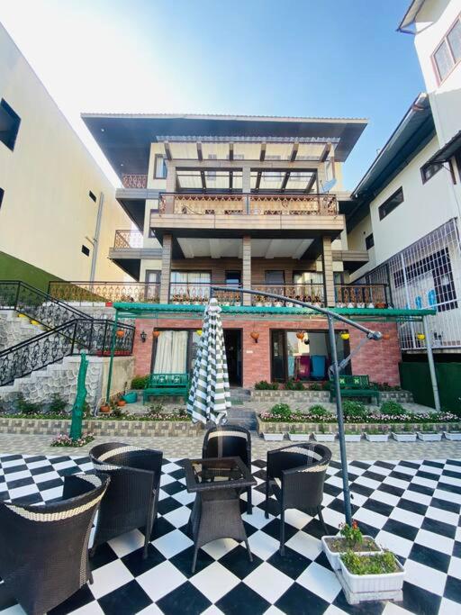 Aurora 4BHK villa with fireplace and terrace by Homeyhuts