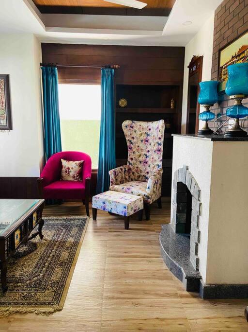 Aurora 4BHK villa with fireplace and terrace by Homeyhuts