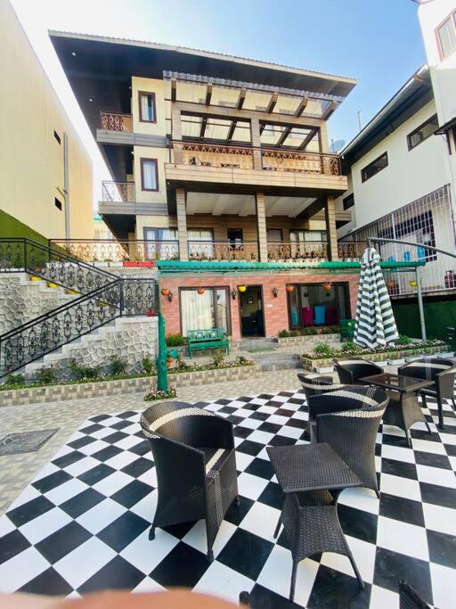 Aurora 4BHK villa with fireplace and terrace by Homeyhuts