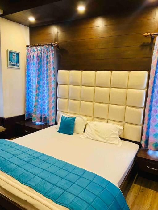 Aurora 4BHK villa with fireplace and terrace by Homeyhuts
