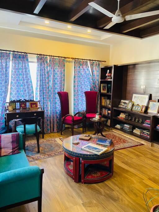 Aurora 4BHK villa with fireplace and terrace by Homeyhuts