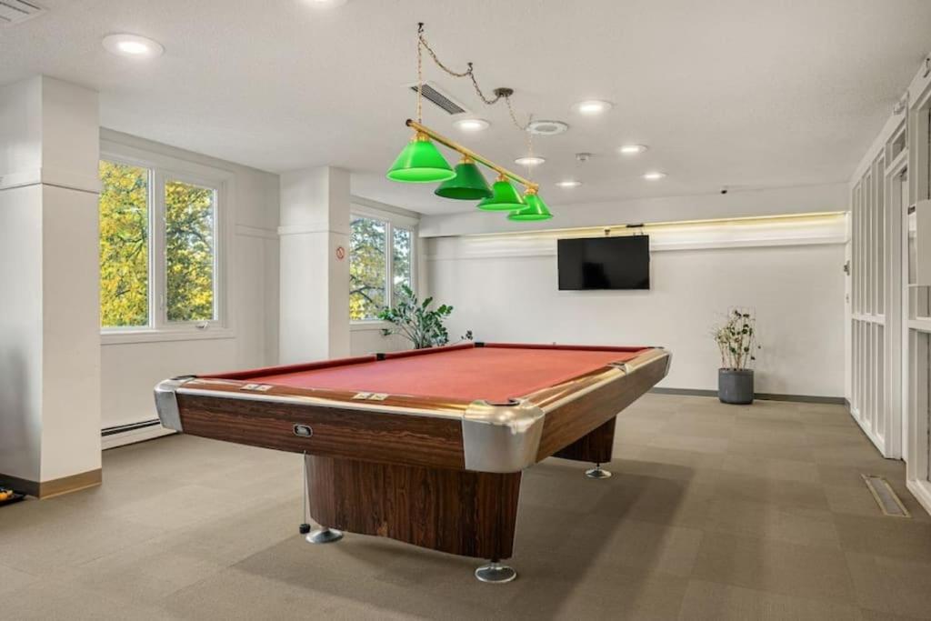 Downtown Near Rogers Place with Covered Parking, Sleeps 6, Pool Table, Sauna, Gym, Two Bedrooms & More