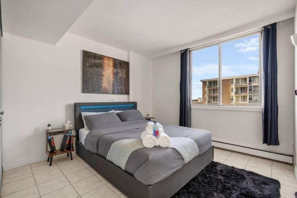 Downtown Near Rogers Place with Covered Parking, Sleeps 6, Pool Table, Sauna, Gym, Two Bedrooms & More