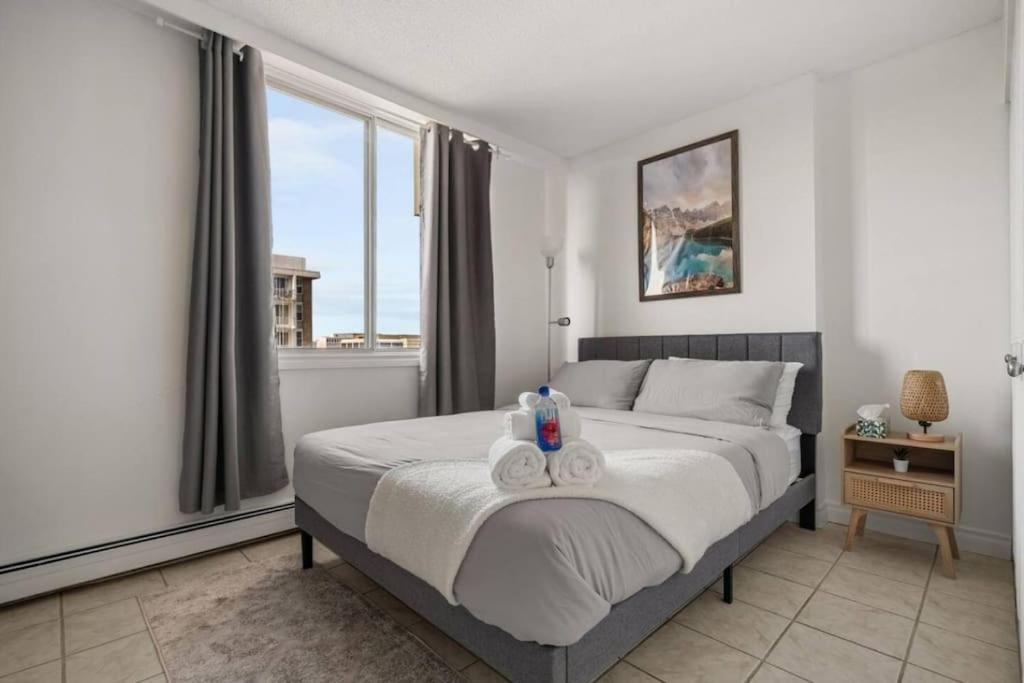 Downtown Near Rogers Place with Covered Parking, Sleeps 6, Pool Table, Sauna, Gym, Two Bedrooms & More
