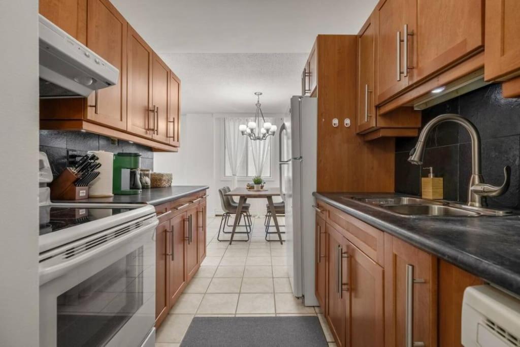 Downtown Near Rogers Place with Covered Parking, Sleeps 6, Pool Table, Sauna, Gym, Two Bedrooms & More