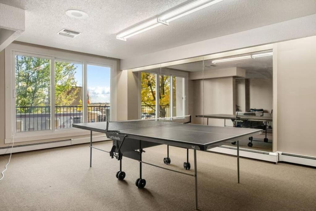 Downtown Near Rogers Place with Covered Parking, Sleeps 6, Pool Table, Sauna, Gym, Two Bedrooms & More