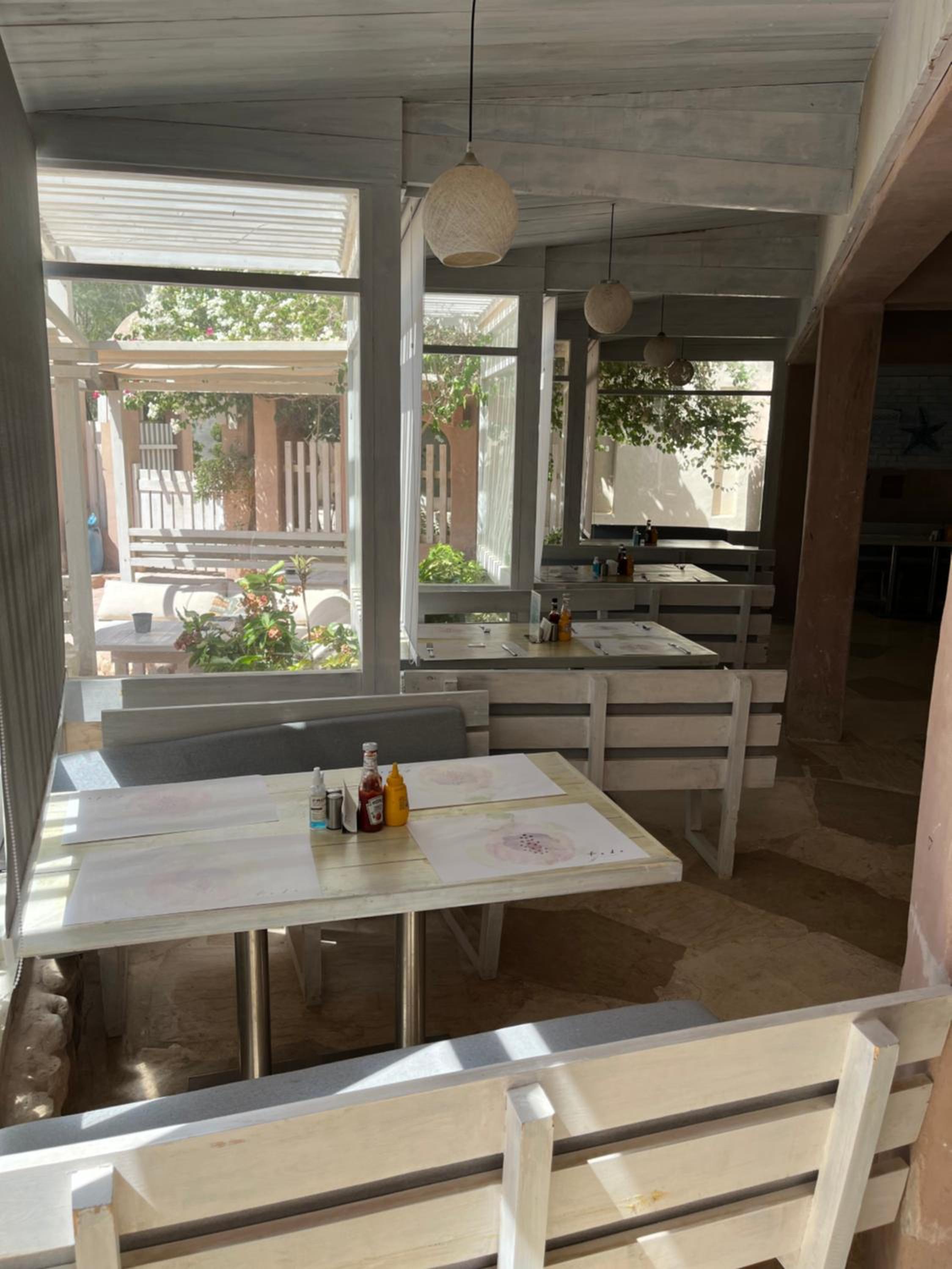 Studio with Private Door Front Seating Area at La Hacienda