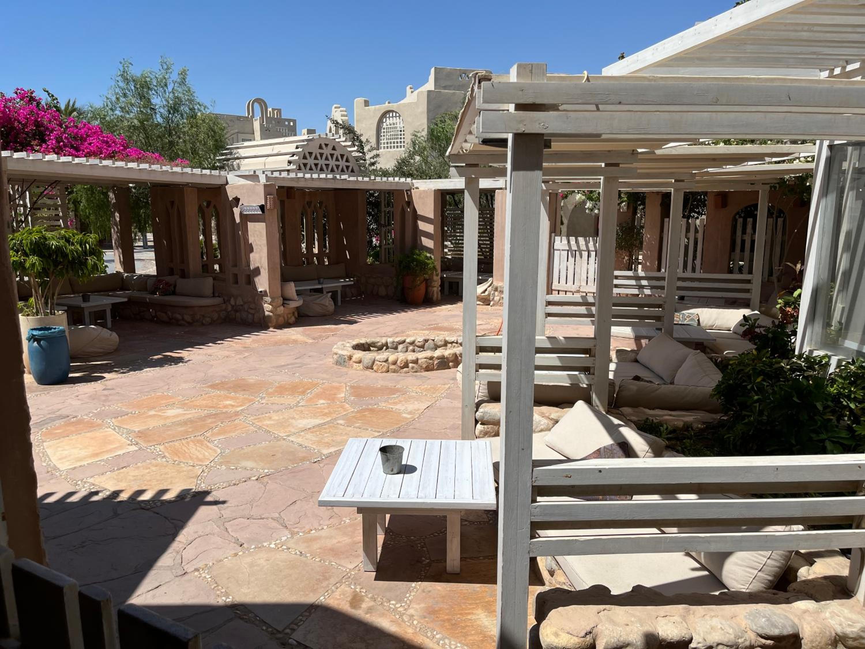 Studio with Private Door Front Seating Area at La Hacienda