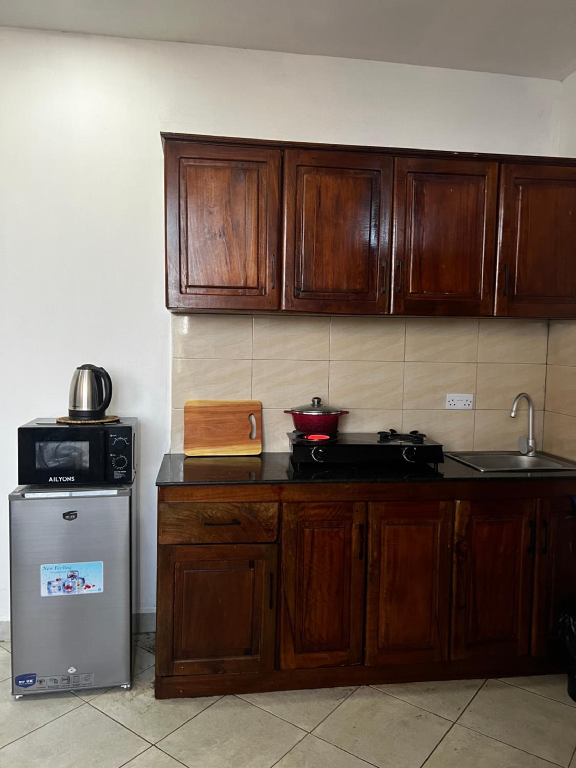 Accessible home near Mlimani City Mall with free WiFi & parking view 3