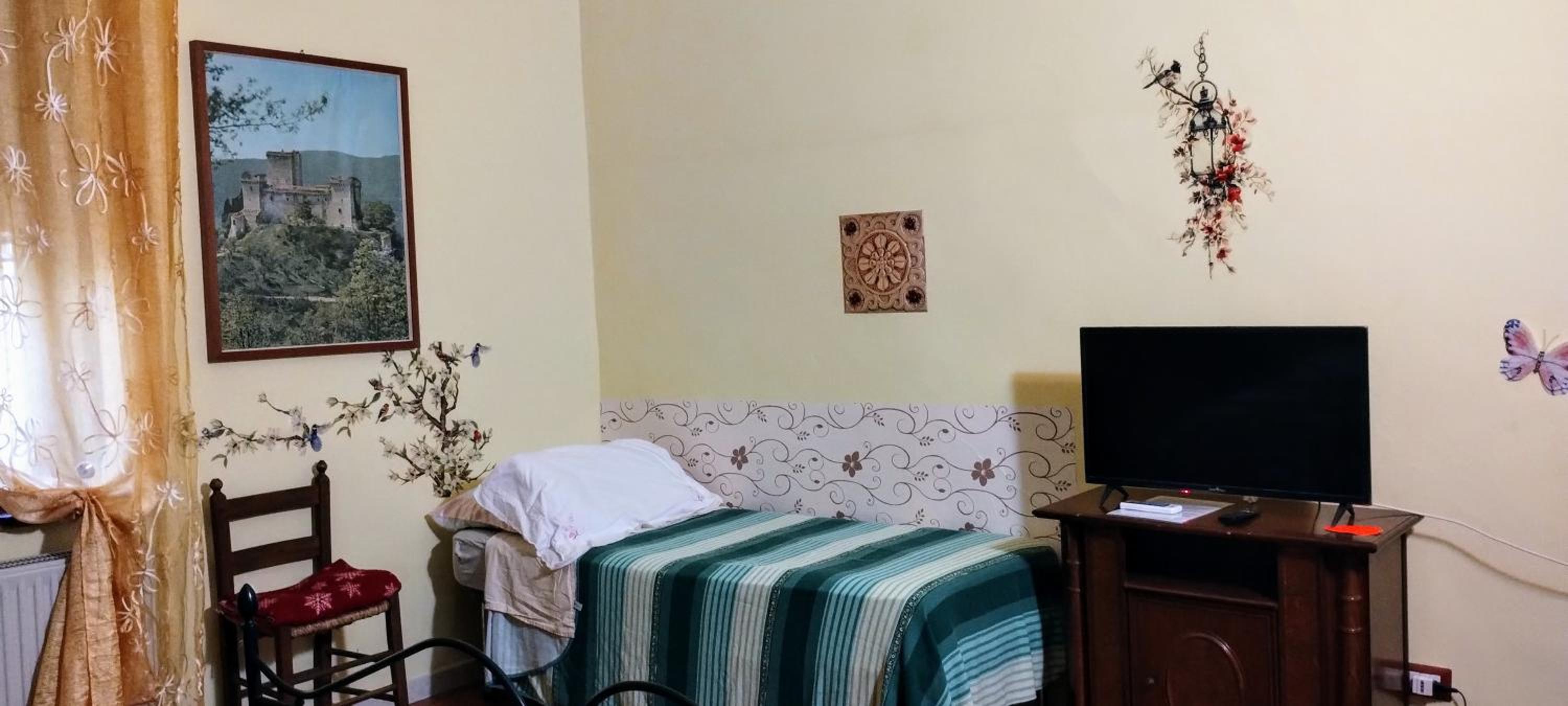 la maison en Todi — hotel room