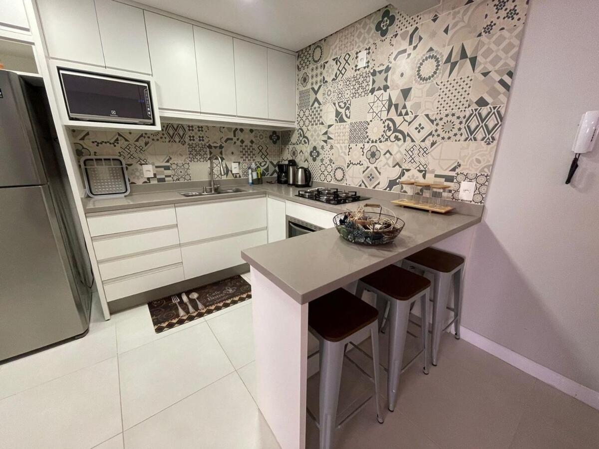 Cód 27 - Apartamento térreo com jacuzzi e área gourmet na Praia de Palmas