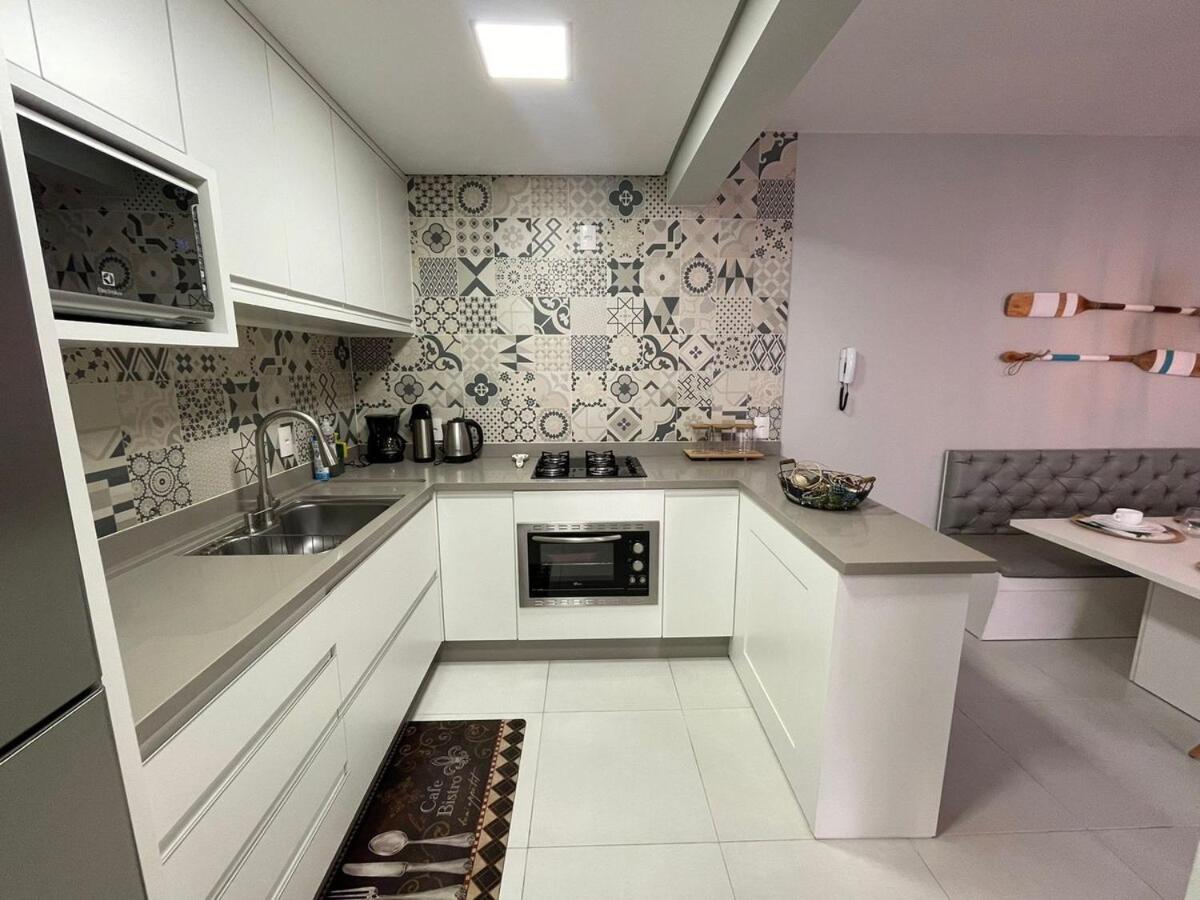 Cód 27 - Apartamento térreo com jacuzzi e área gourmet na Praia de Palmas