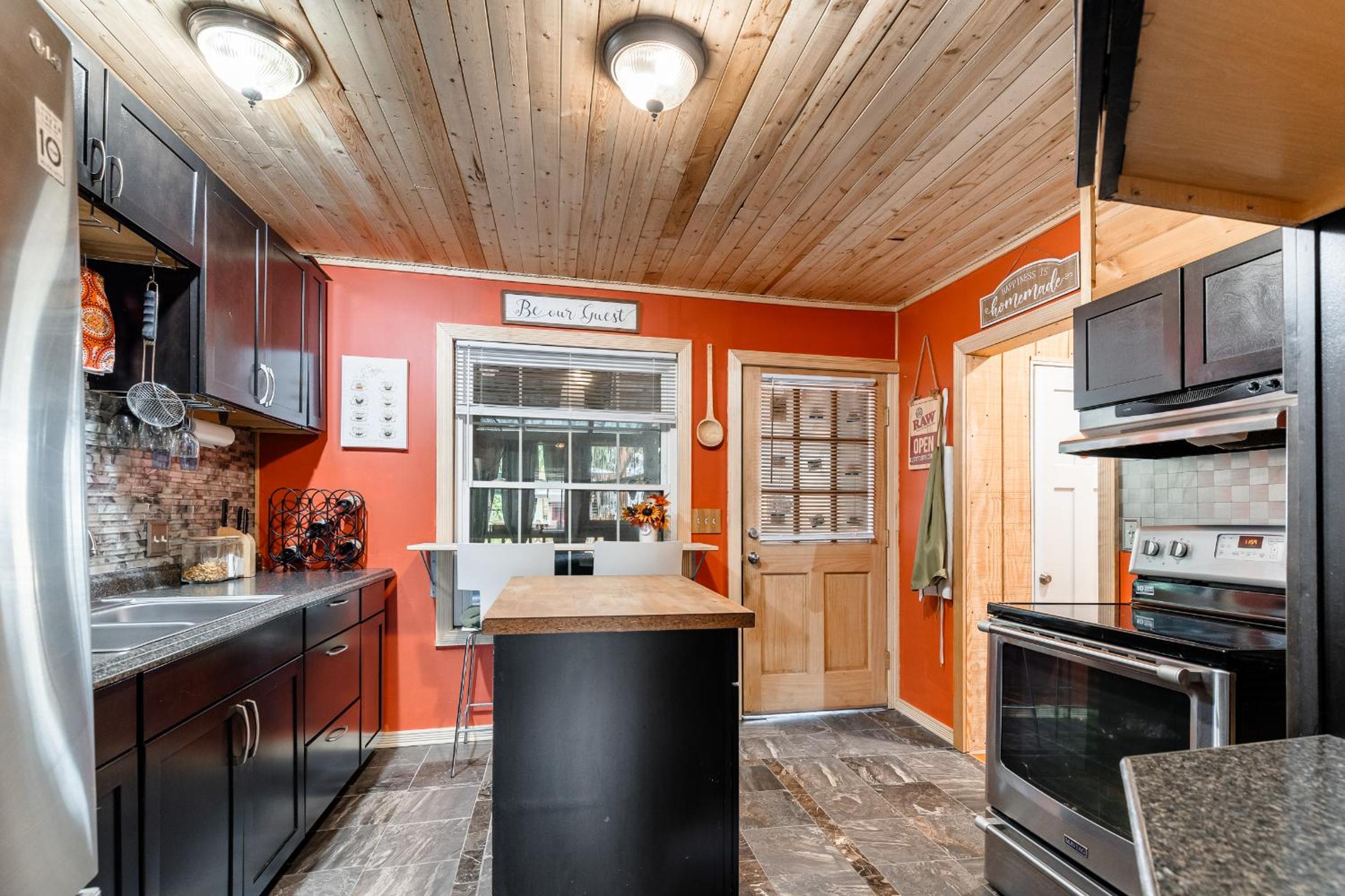Charming home with patios fireplace and BBQ area view 5