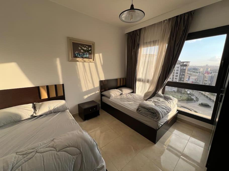 City View 2Brs Direct to the Pool - New Cairo