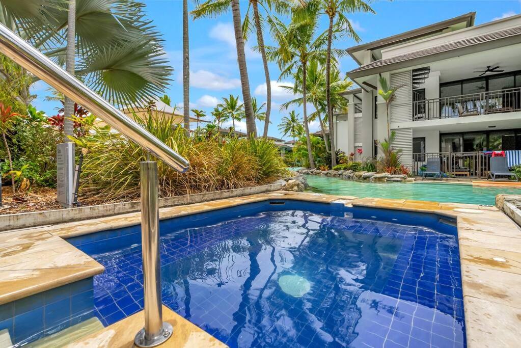 Luxury Port Douglas beachside 3 Bedroom Temple Apartment with Private roof top terrace Due to copyright we can't disclose the resort name but google Port D