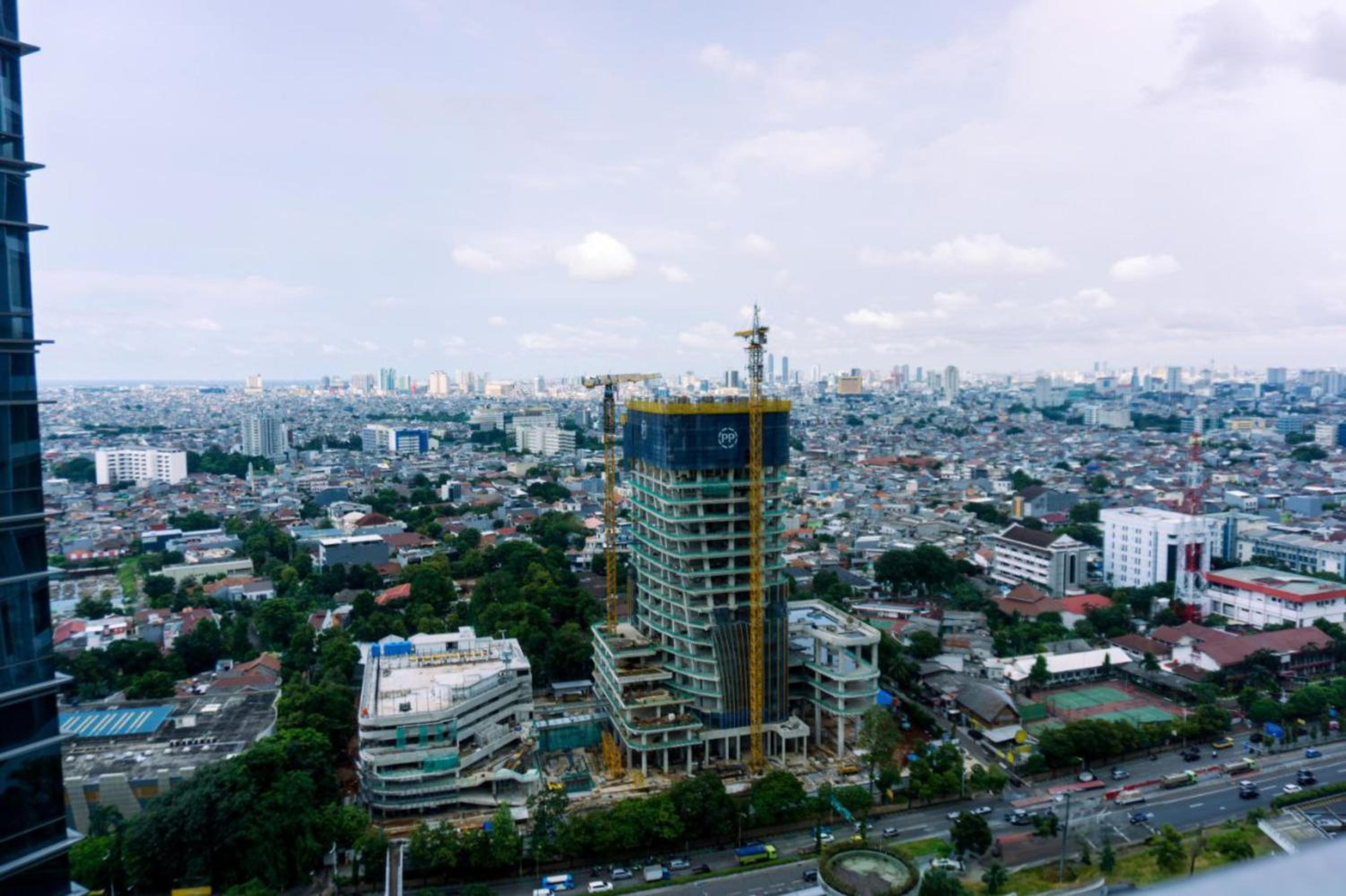 Modern Look and Spacious 1BR at Neo Soho Apartment By Travelio