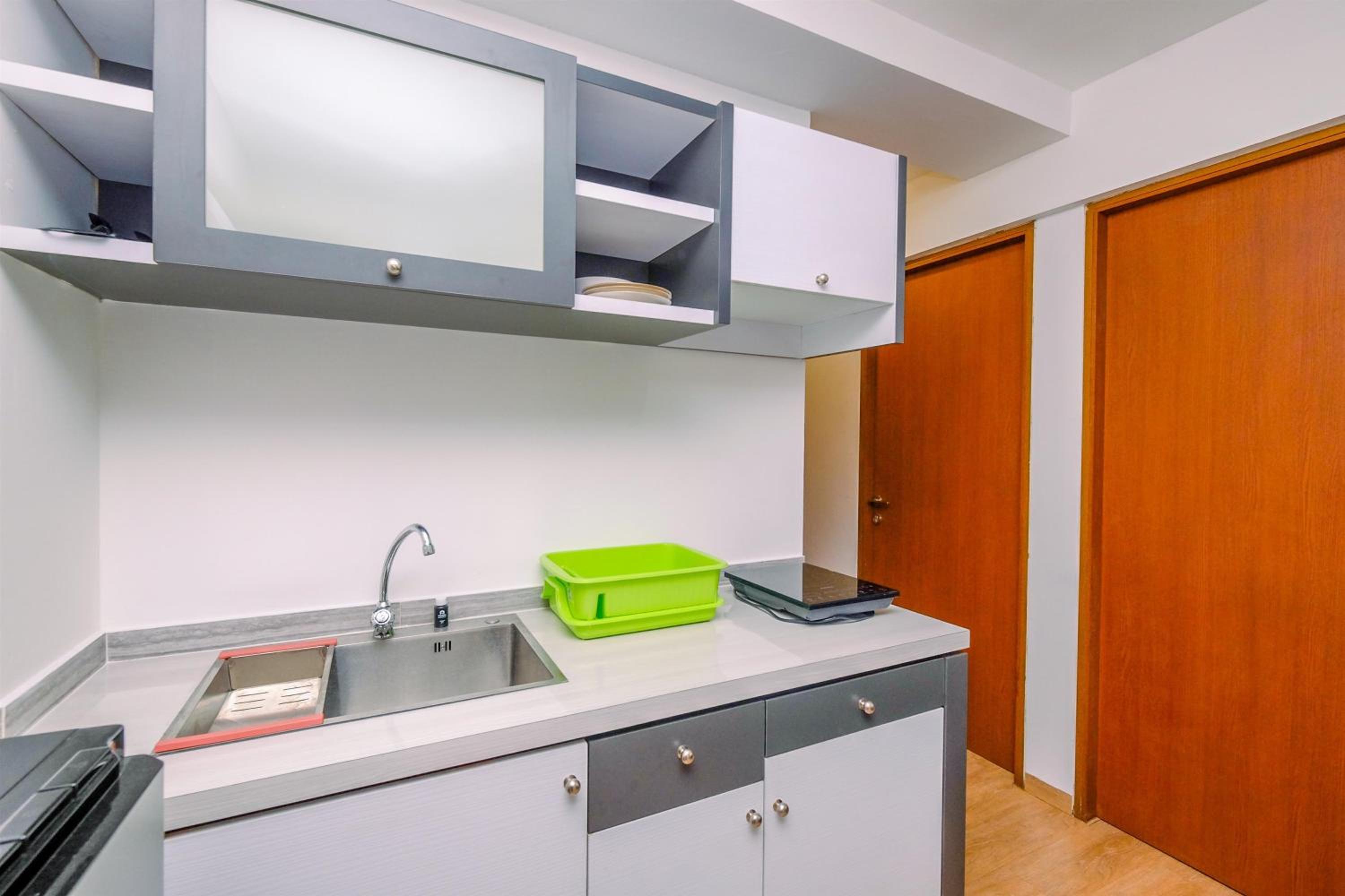 Comfortable and Warm 2BR at Tifolia Apartment By Travelio view 3