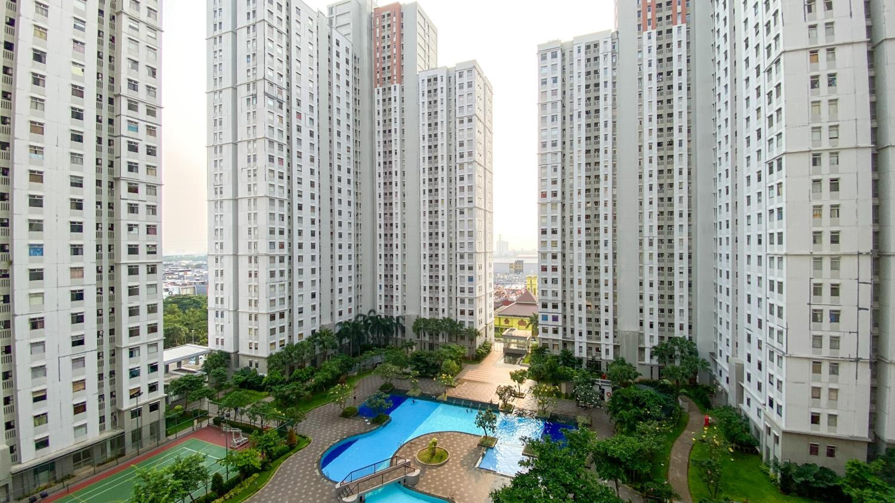 Comfortable 2BR at Green Bay Pluit Apartment By Travelio