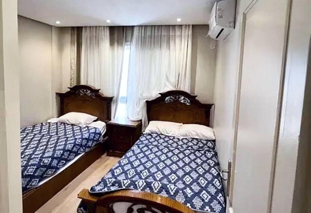 Spacious Cozy 2BR Apartment in B12 Madinaty Modern Balcony with Relaxing Patio AC Near Parks Shopping in New Cairo view 5
