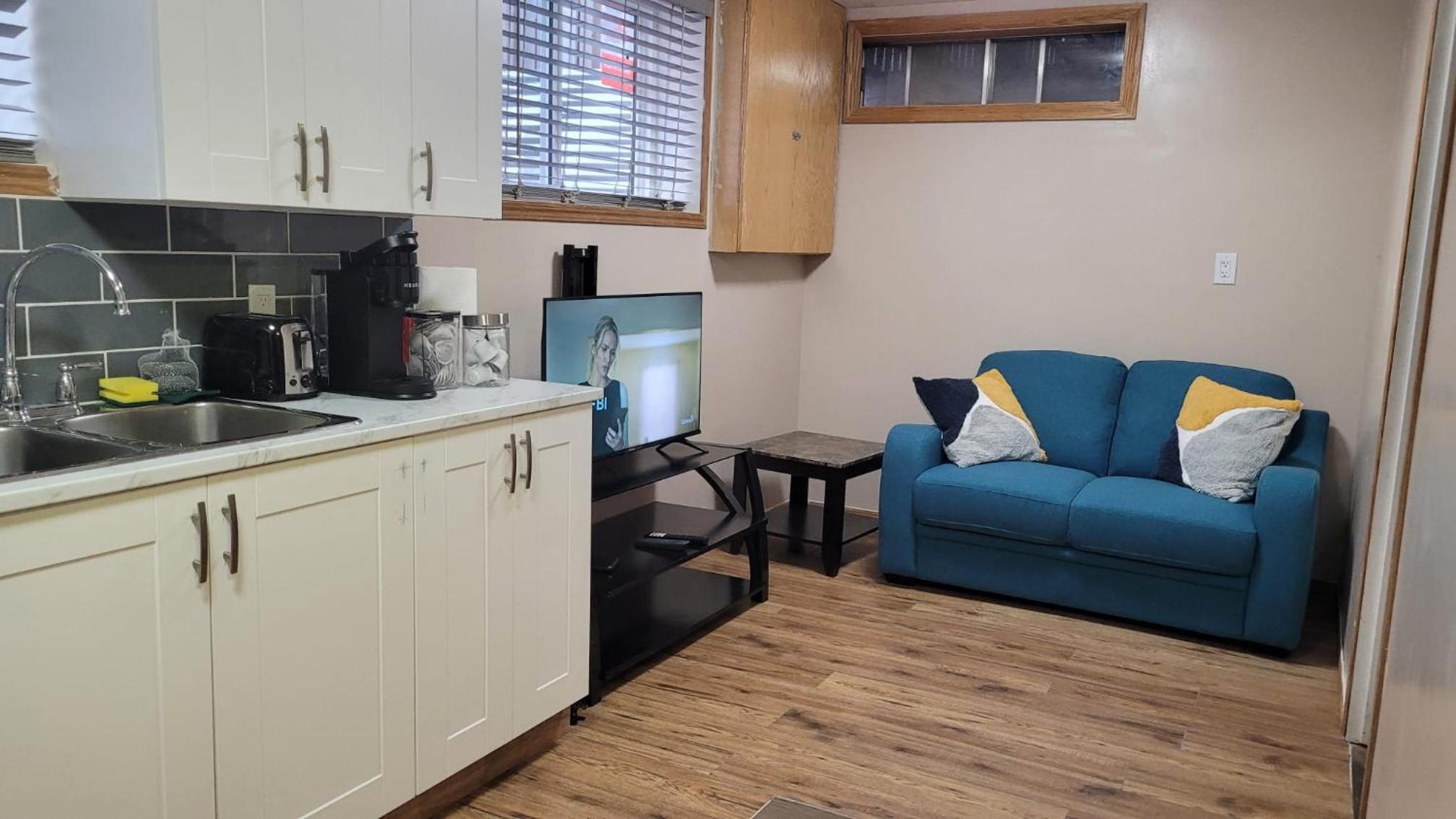 Basement- Elegant 4-Bedroom Family Home 2