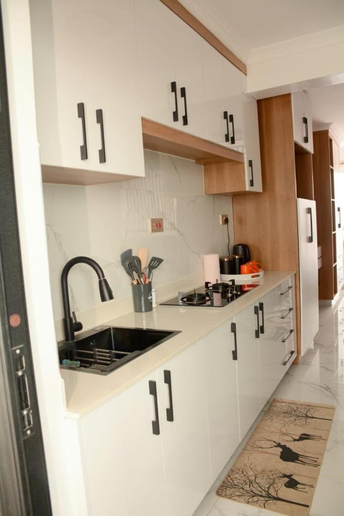Cozy partitioned studio in Smarthomes Serviced Apartment-Kilimani
