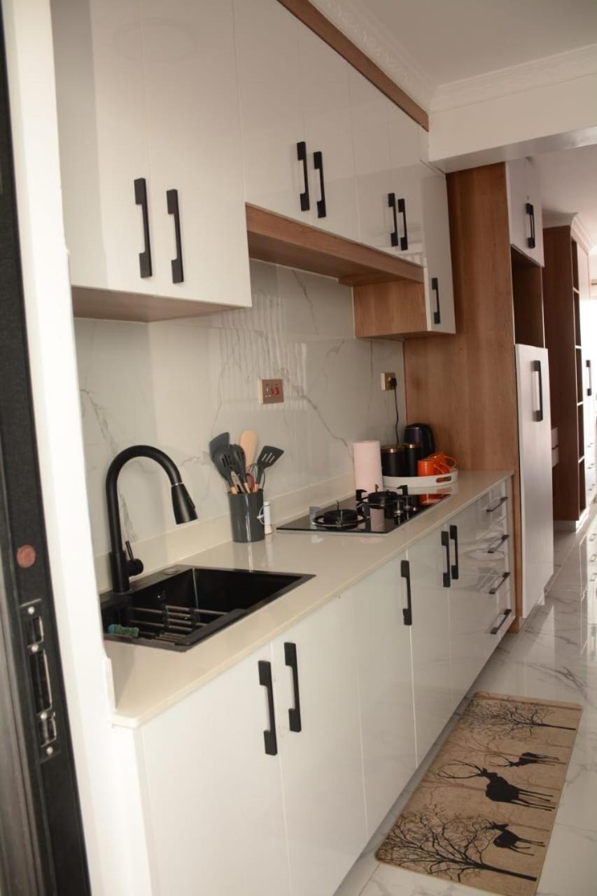 Cozy partitioned studio in Smarthomes Serviced Apartment-Kilimani