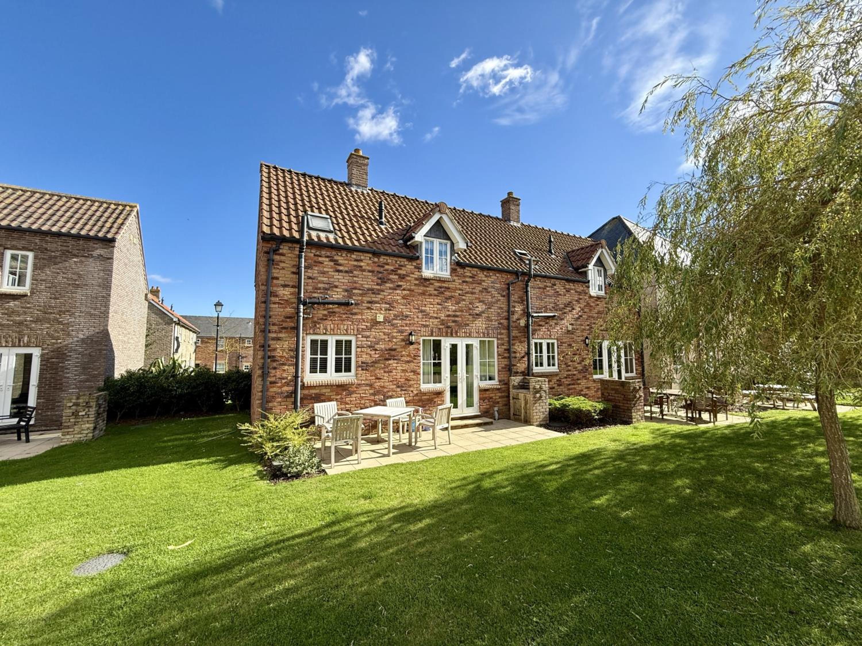 High Tide Cottage - Part of the The Bay Filey Holiday Village with pool, gym and direct beach access, pub, restaurant, tennis and meadows walks