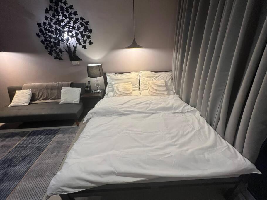 Cozy Makati Condo Getaway with balcony view 2