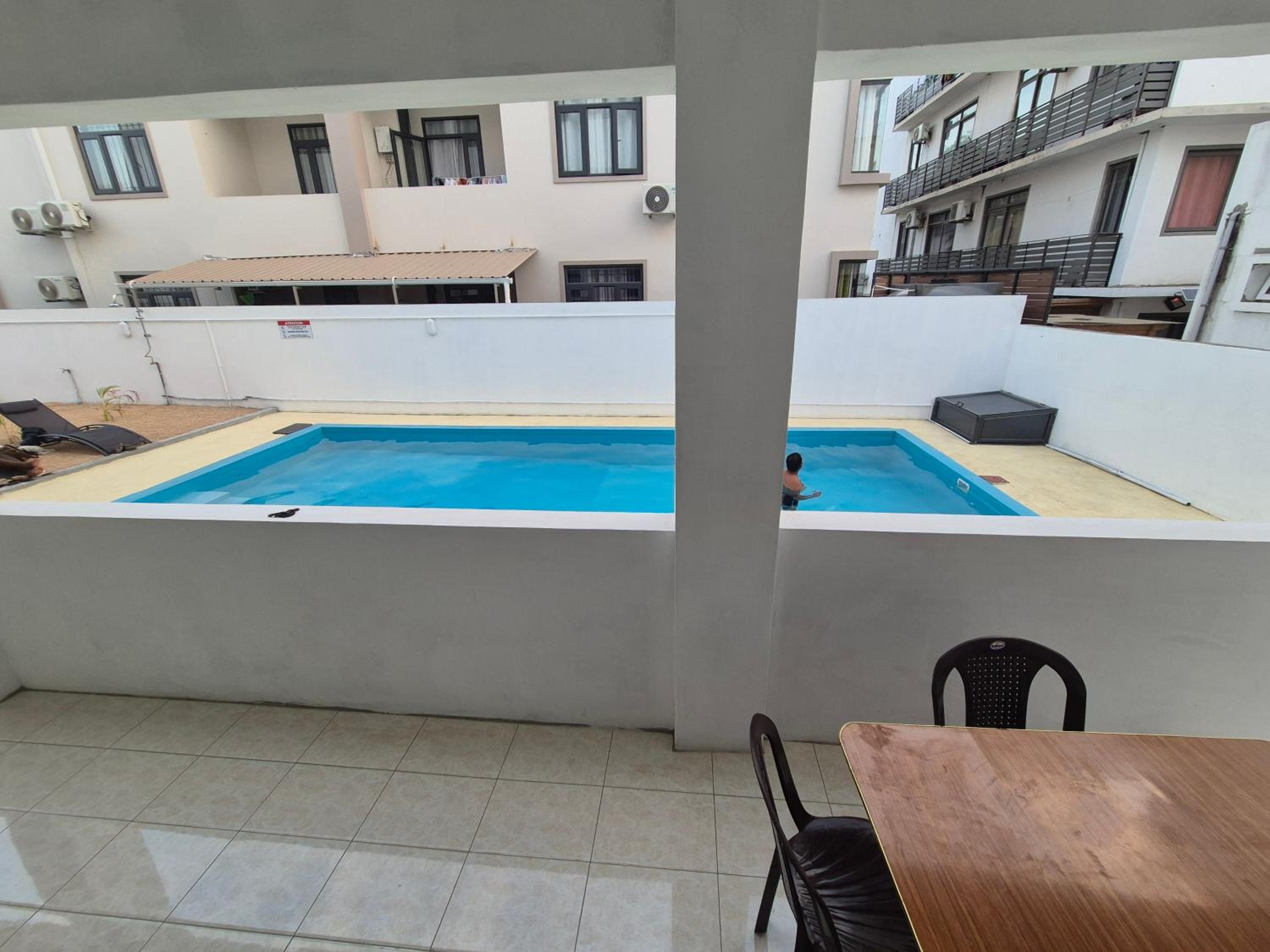 Skyview Apartment- Poolside Stay Near the Beach photo 3