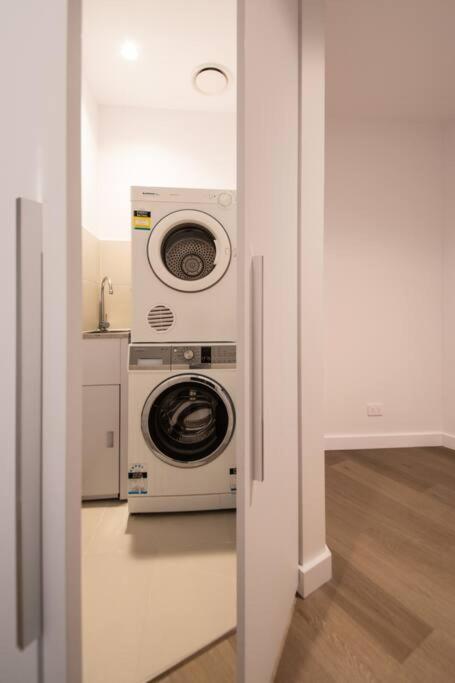 Great City Stay 2BR Free Tram Gym & Pool