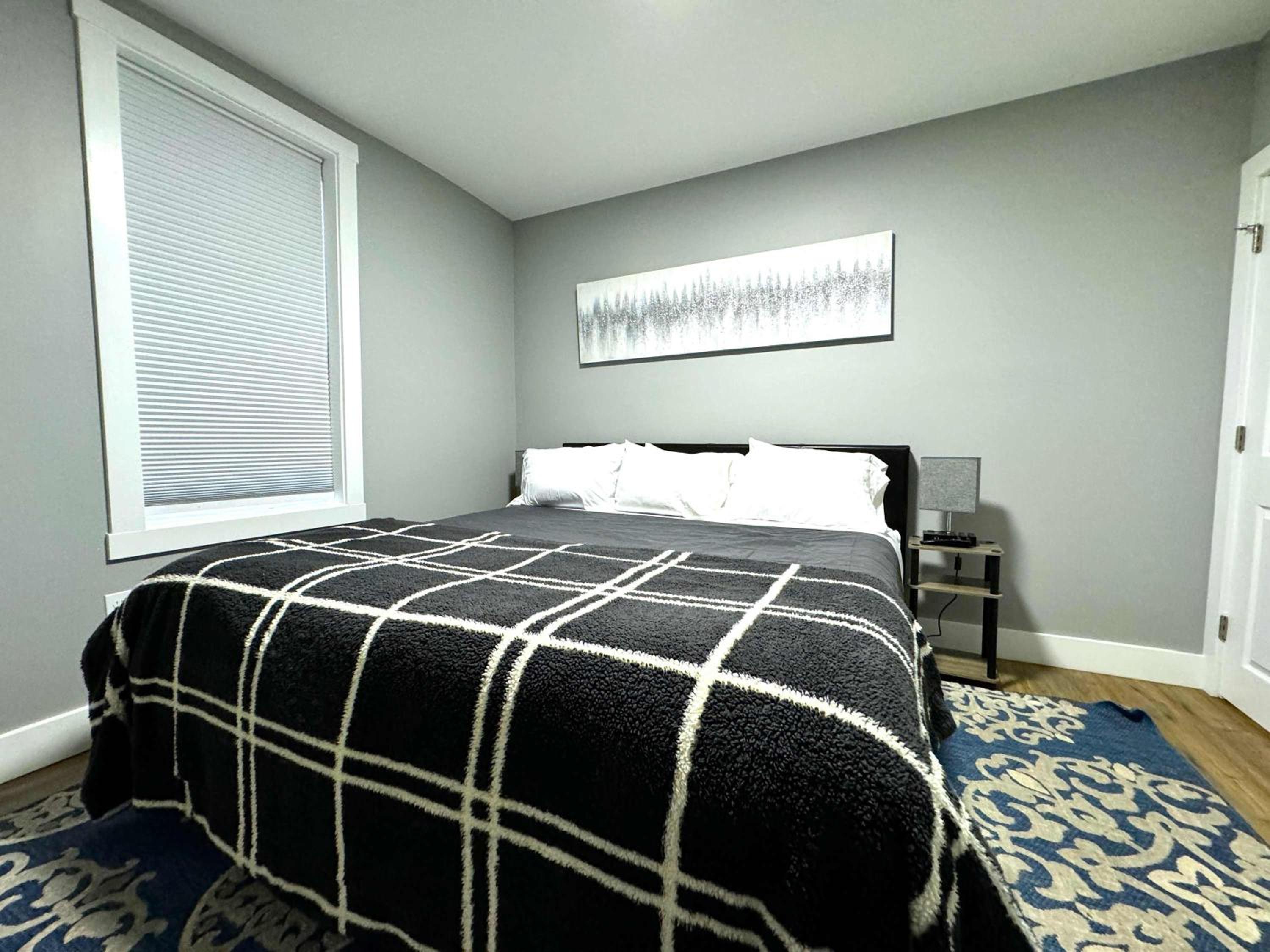 Cozy unit King bed & laundry view 2