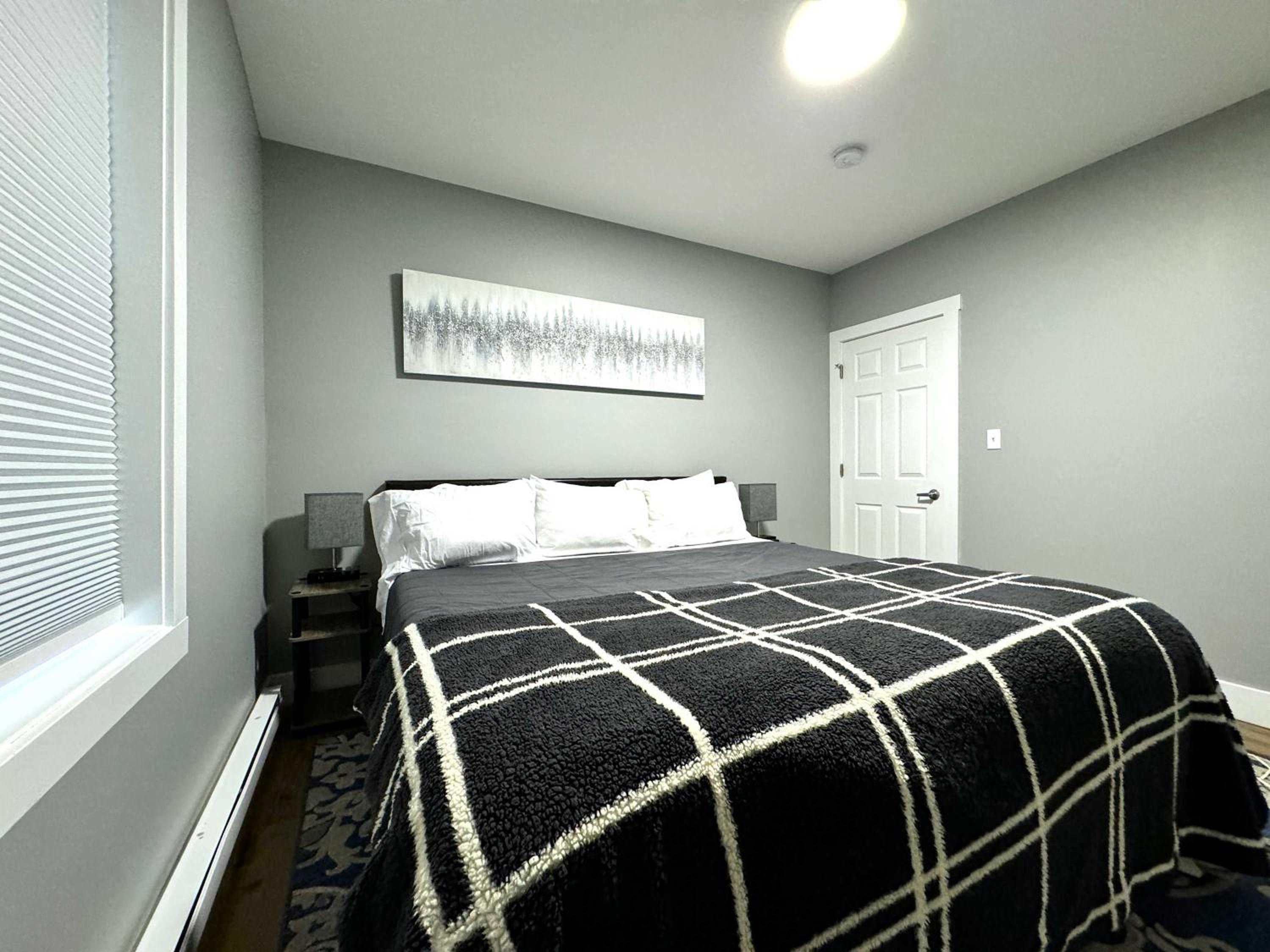 Cozy unit King bed & laundry view 4