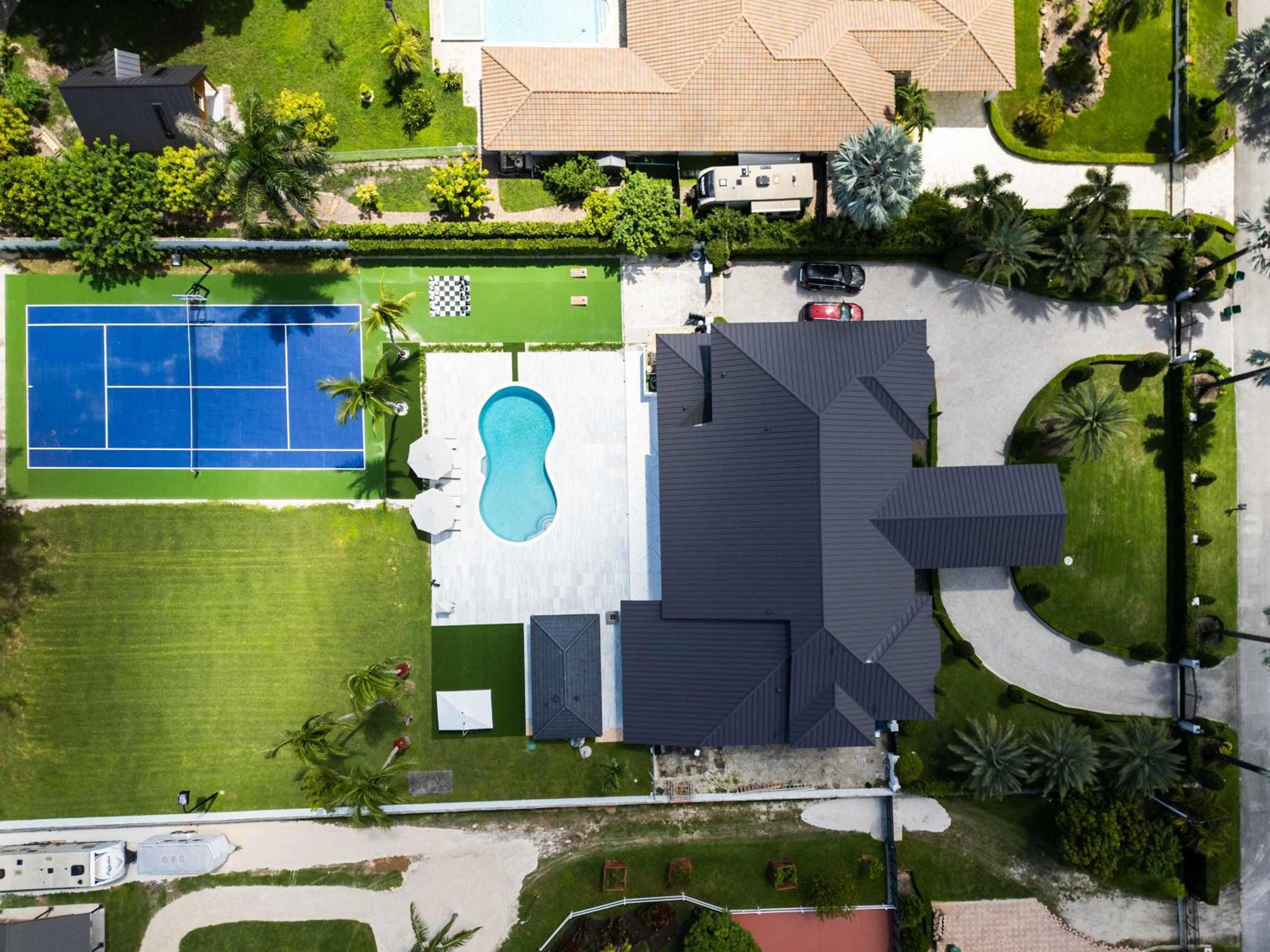 The Mansion Pool Cinema Tennis BBQ Family