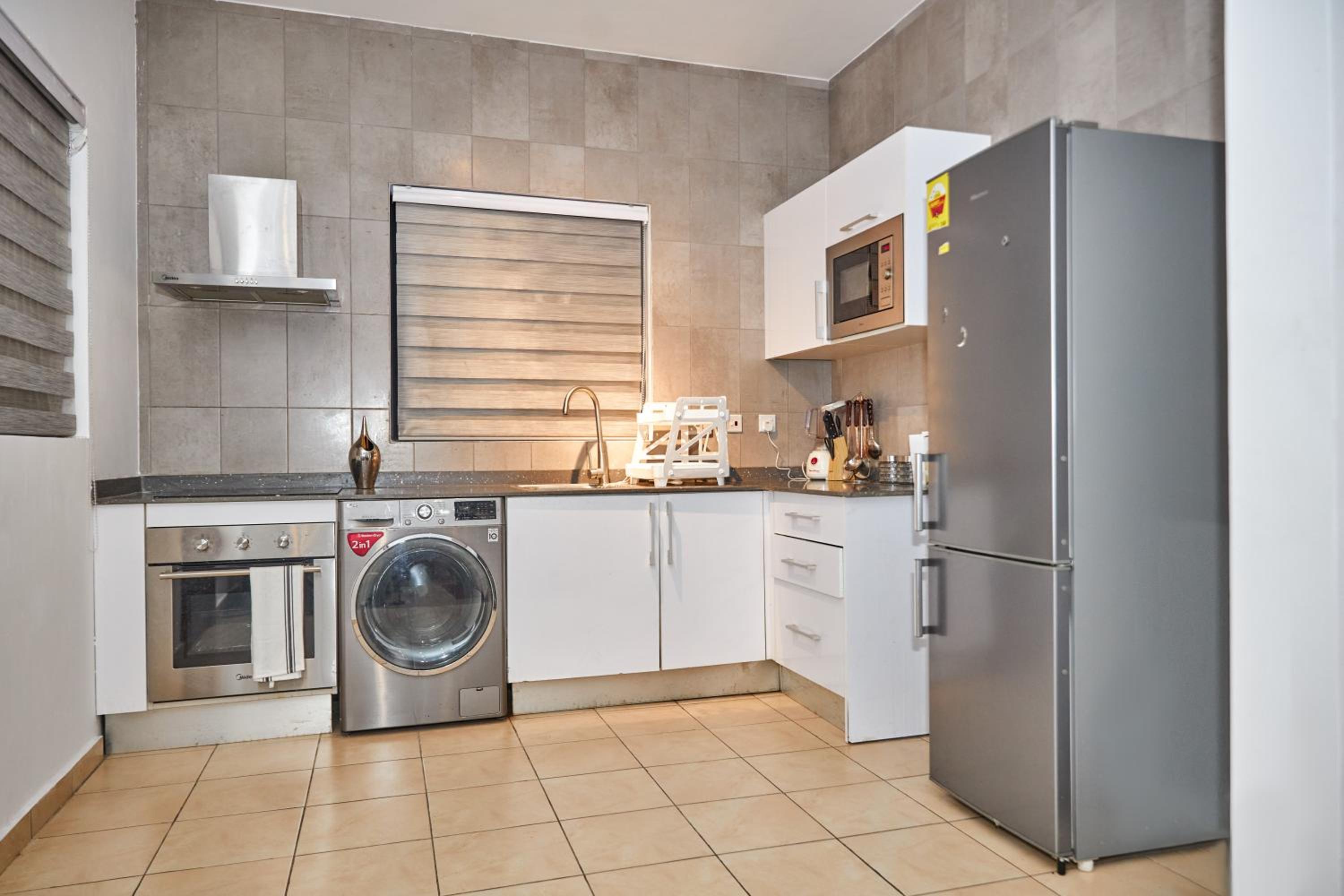 iFORA Homes - Modern Two-Bedroom Condo near A&C Mall view 5